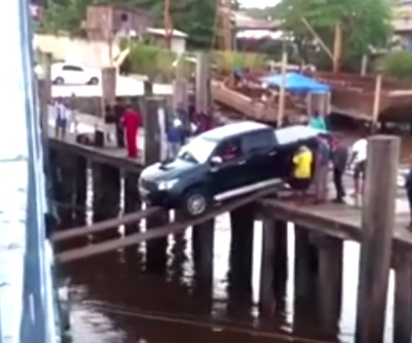 Insane Driver Uses Flimsy Boards to Load Truck onto Ship