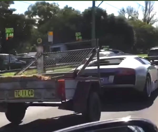 Just a Lamborghini Towing a Goat Cart